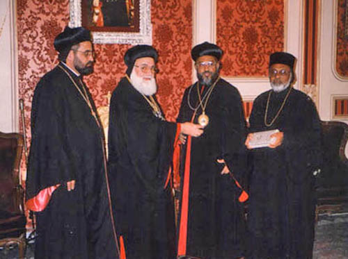 Patriarch HH Ignatius Zakka I Iwas presenting an icon/medal to Themotheos Thirumeni