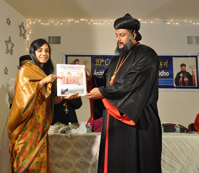 Sunitha Flowerhill presenting Issue 188 of Malankara World Journal to Theethose Thirumeni