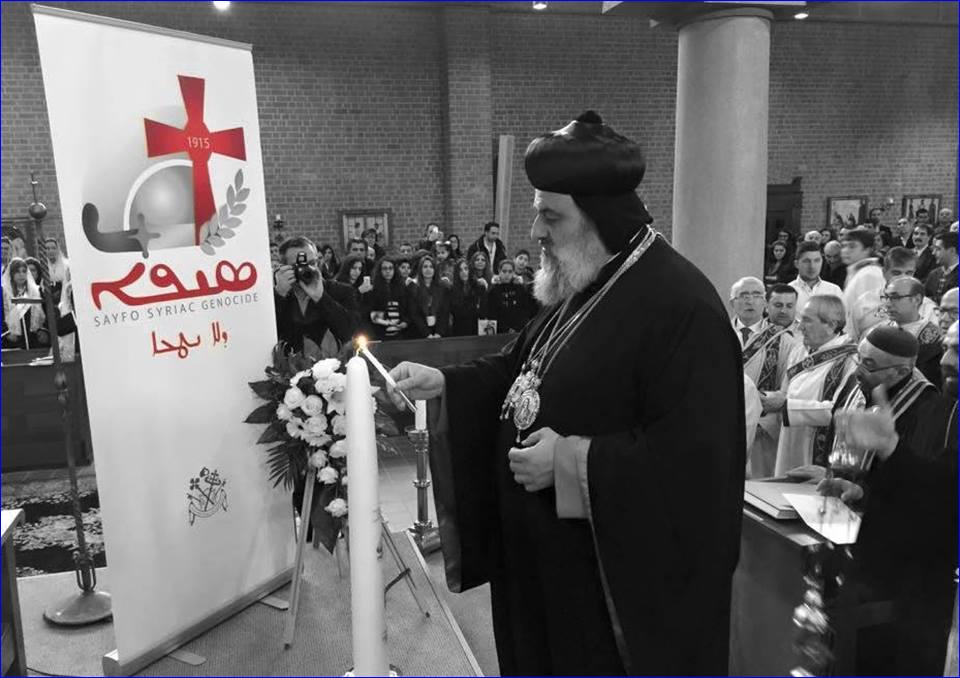 Patriarch Aphrem II lighting a candle at the Sayfo Centennial